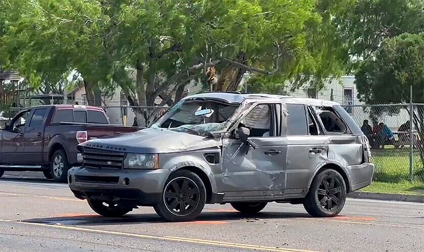 A damaged vehicle sits at the site of a deadly collision near a bus stop in Brownsville,...