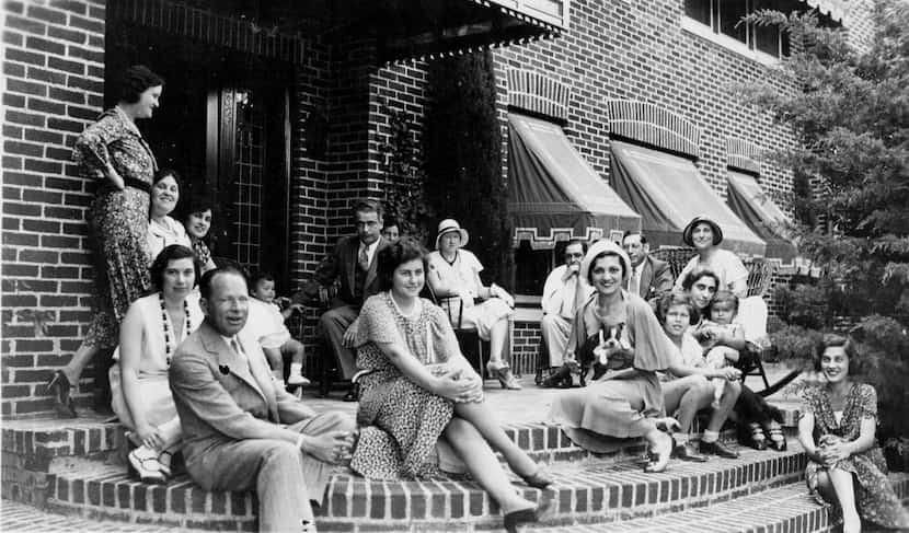 An undated photograph of the Marcus family on Aunt Carrie's front porch on Swiss Avenue in...