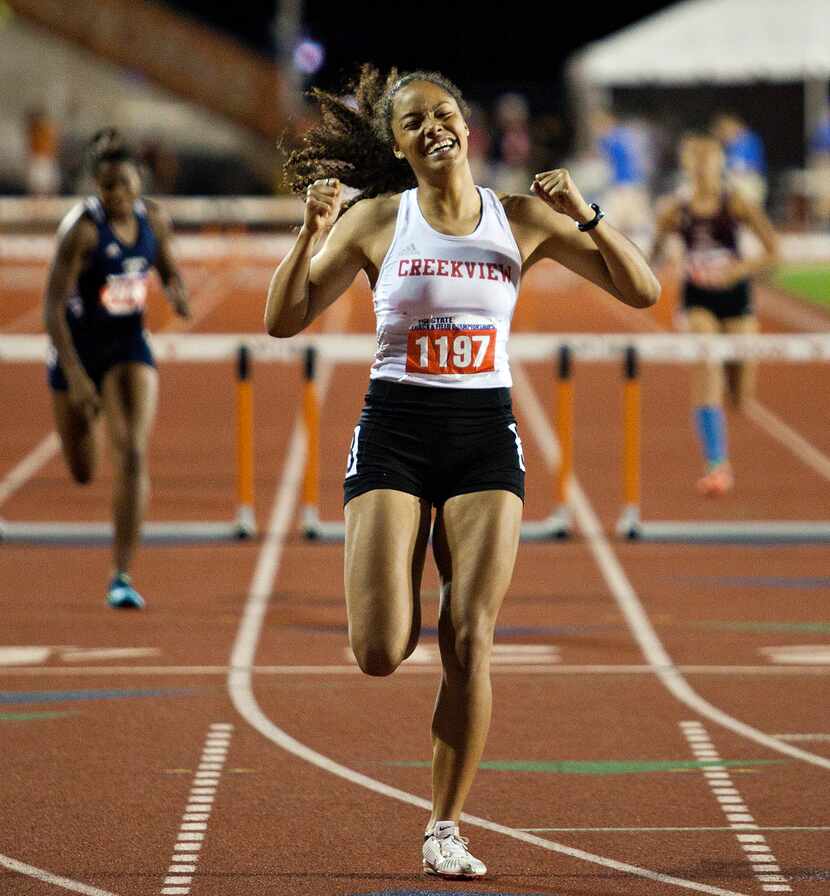 Carrolton Creekview's Sami Gonzalez cheers as she leaves everyone behind and after crossing...
