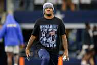 Dallas Cowboys linebacker Micah Parsons wears a shirt with former Dallas Cowboys player...
