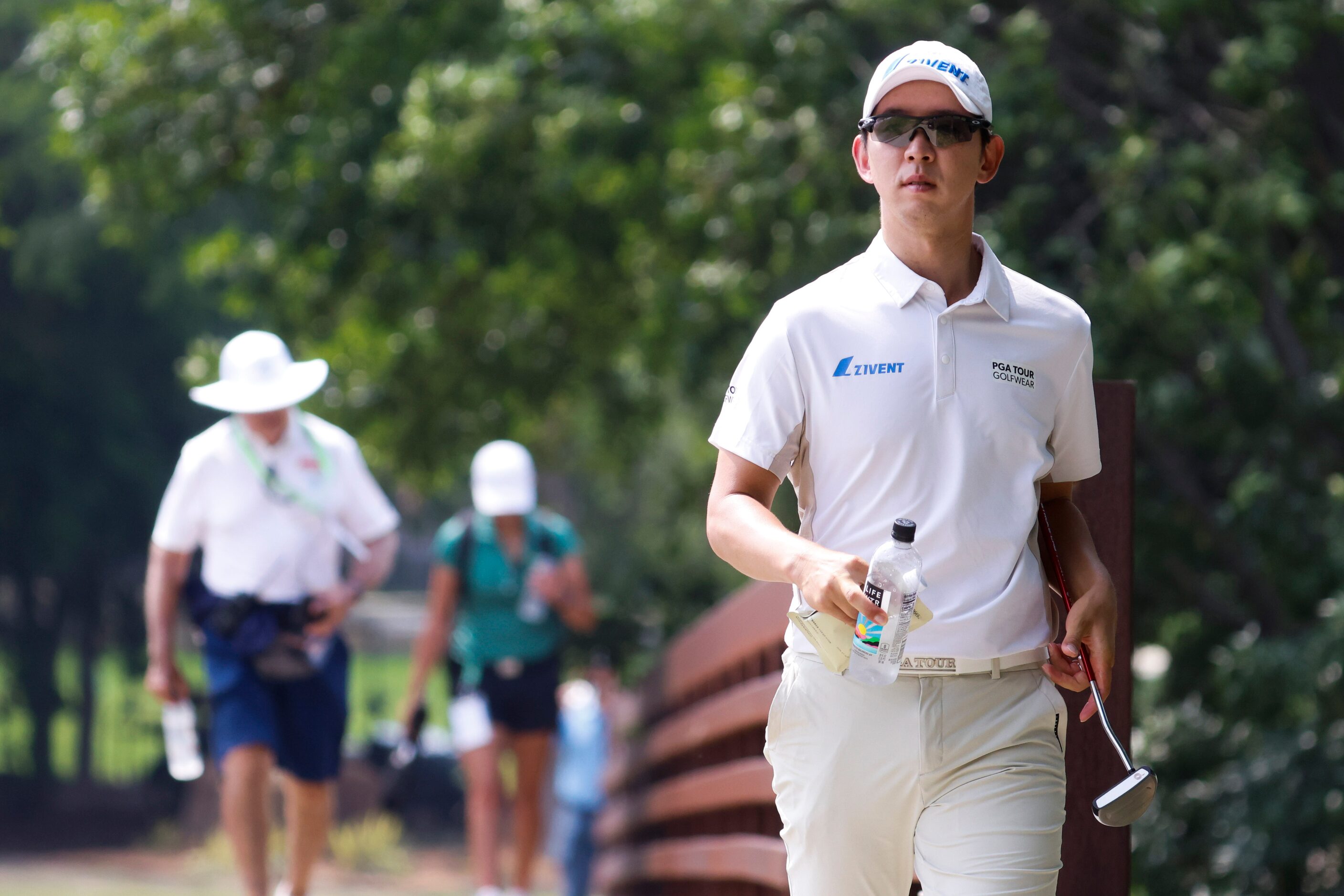 S.Y. Noh of South Korea walks to the fourth hole green during the second round of the AT&T...