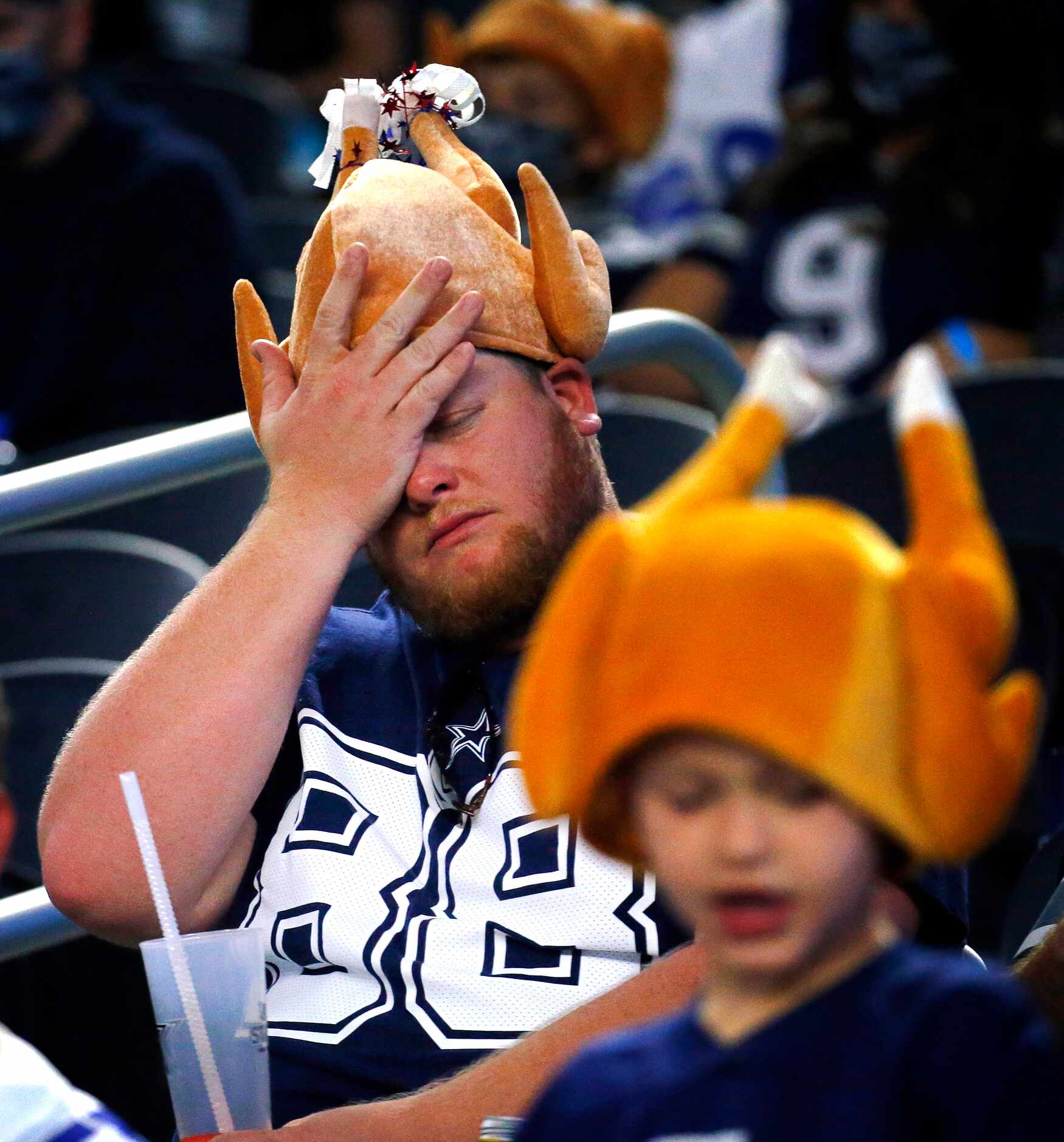 Dallas Cowboys fan Alex Chambers reacts to a missed played Cowboys drive against the...