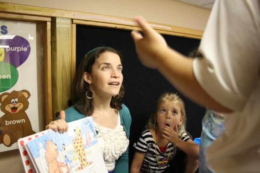 
Rabbi Elana Zelony reads to six year olds at Congregation Beth Torah in Richardson. Rabbi...