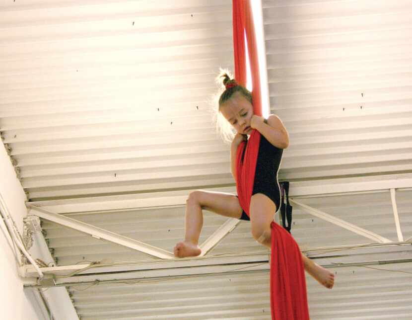 Laruen Rigdon, the youngest member of the Dallas Cirque Theatre, followed in her sister's...