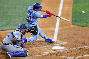 Texas Rangers outfielder Wyatt Langford (36) connects on an RBI double during the fourth...