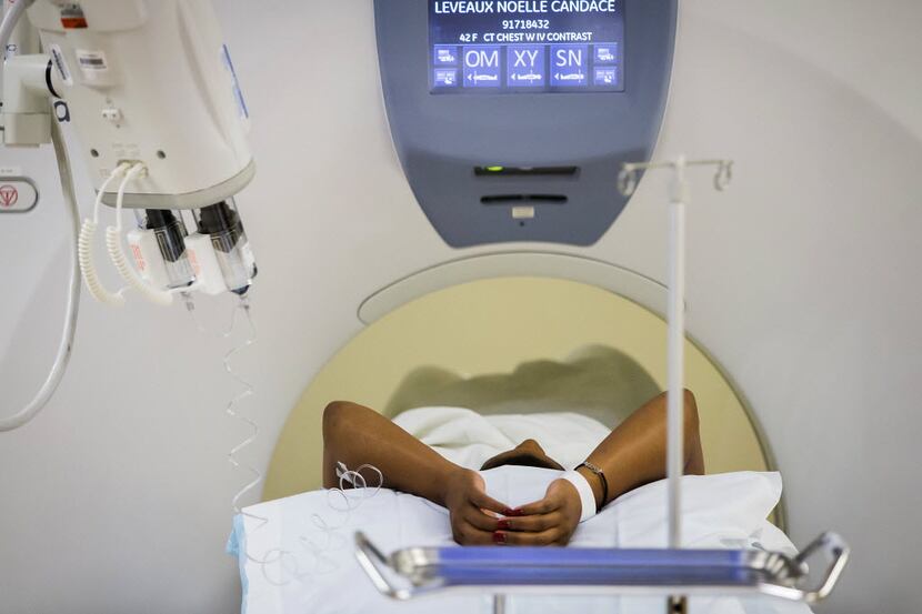 File photo of breast cancer survivor having a CT scan performed to check for recurrence.