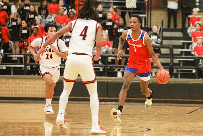Duncanville High School’s Ron Holland (1) dribbles up the court at Mansfield Legacy High...