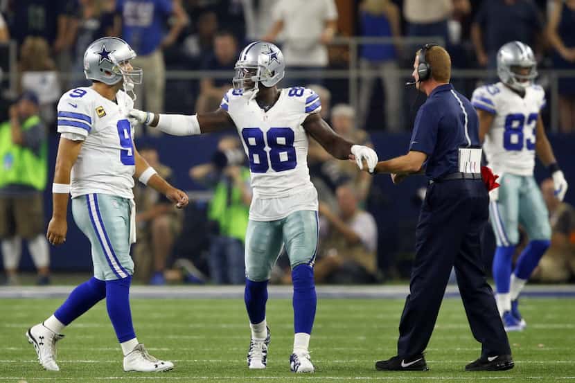 Dallas Cowboys wide receiver Dez Bryant (88) apologizes to quarterback Tony Romo (9) after...