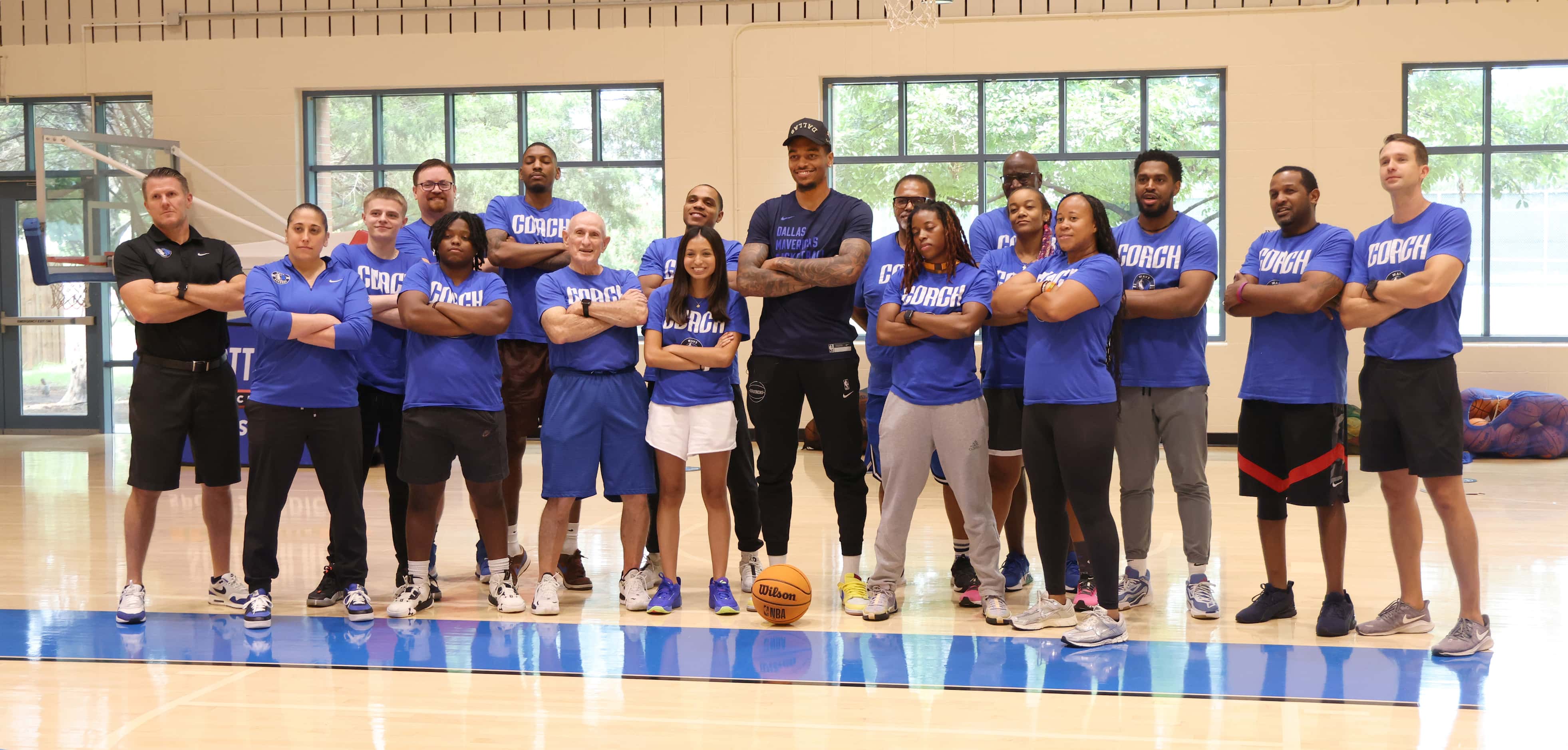 Dallas Mavericks forward and center PJ Washington, center, poses for a group photo with Hoop...