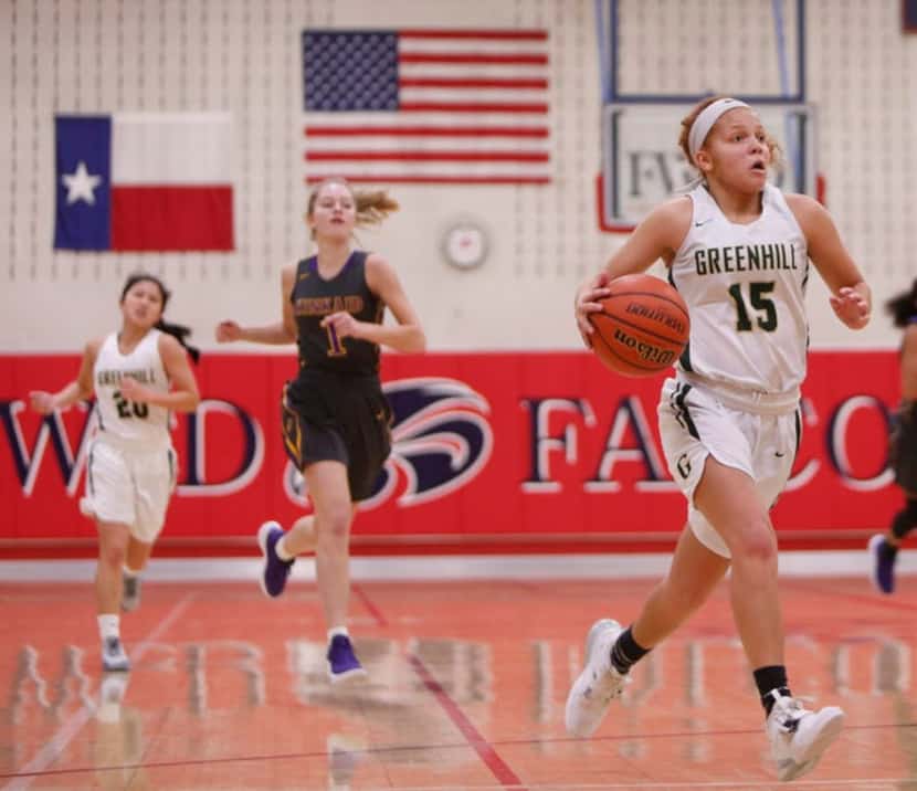 Greenhill's Jade Currington (15) bolts to the basket during second half action against...