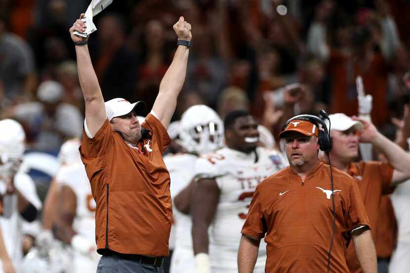 Texas coach Tom Herman celebrates a touchdown during the second half against Georgia in the...