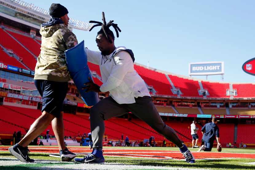 Dallas Cowboys defensive end Demarcus Lawrence (90) works out during pregame warmups before...