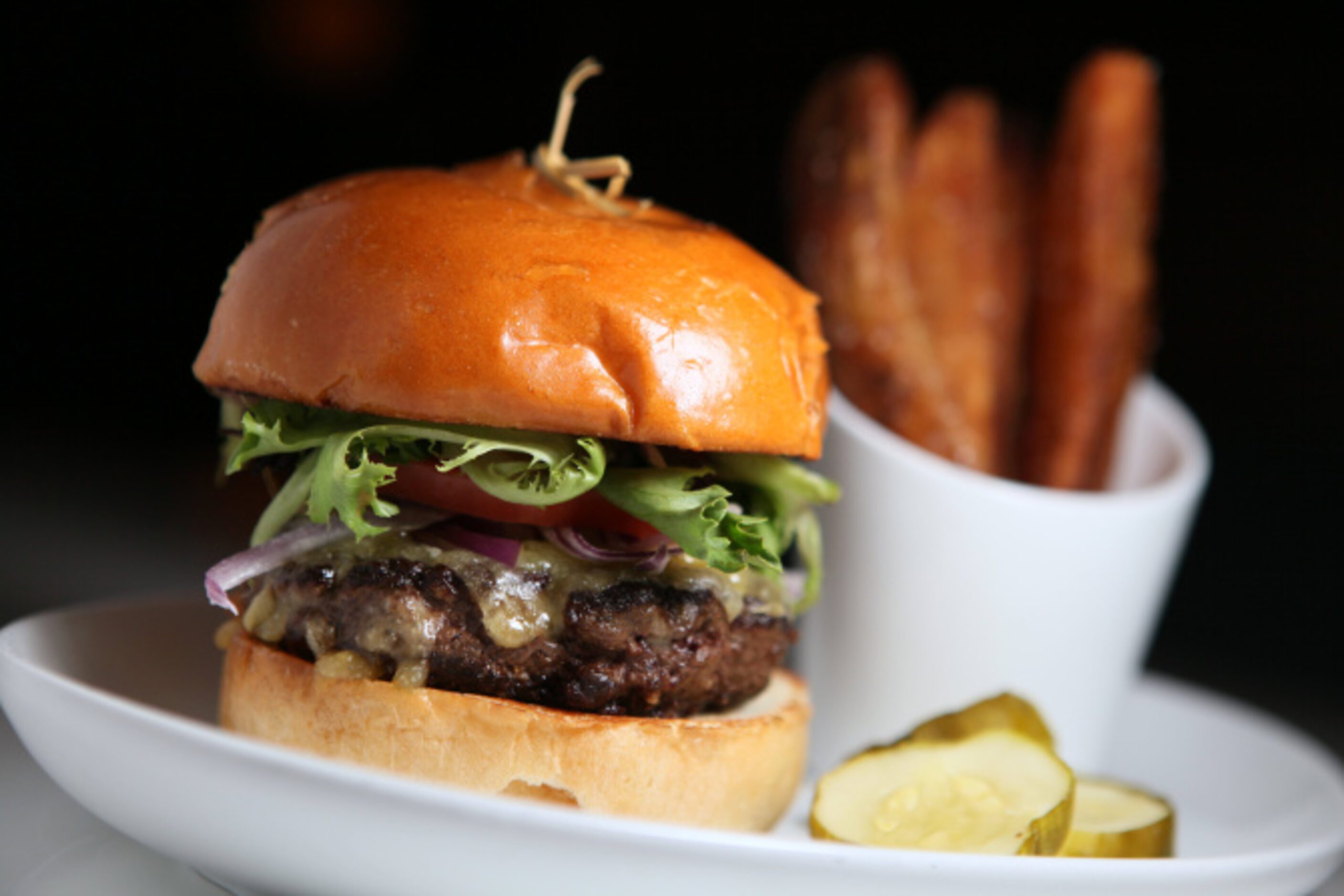 Ground wagyu burger served on empire challah bun and fries, from The Front Room: A Park...