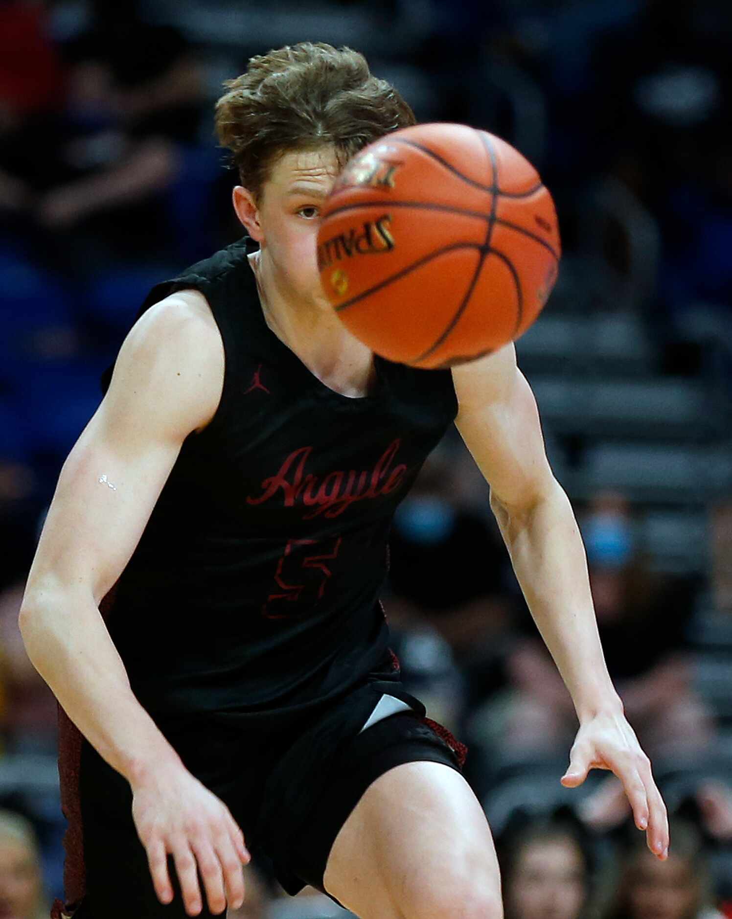 Argyle Slate McMellian #5 keeps his eyes on the ball after a steal. UIL boys Class 4A...