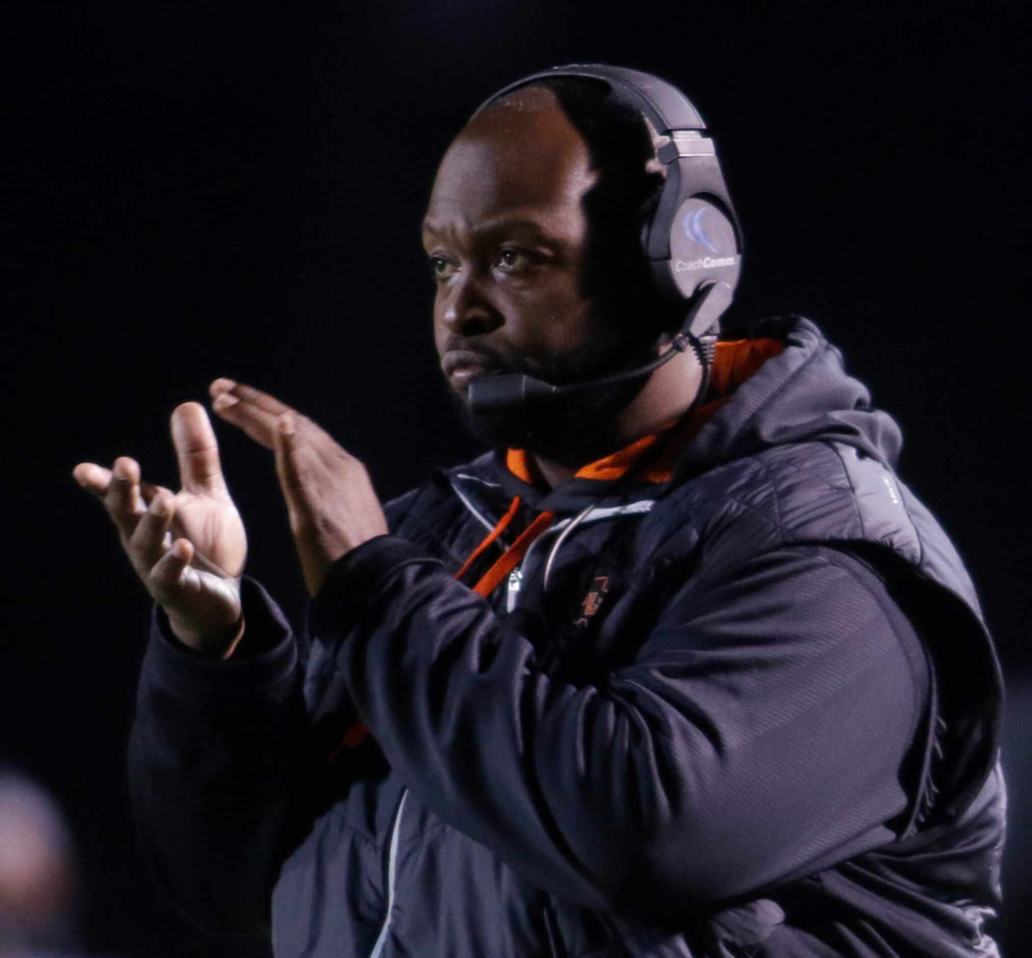 Lancaster head coach Chris Gilbert applauds an offensive drive resulting in a score during...