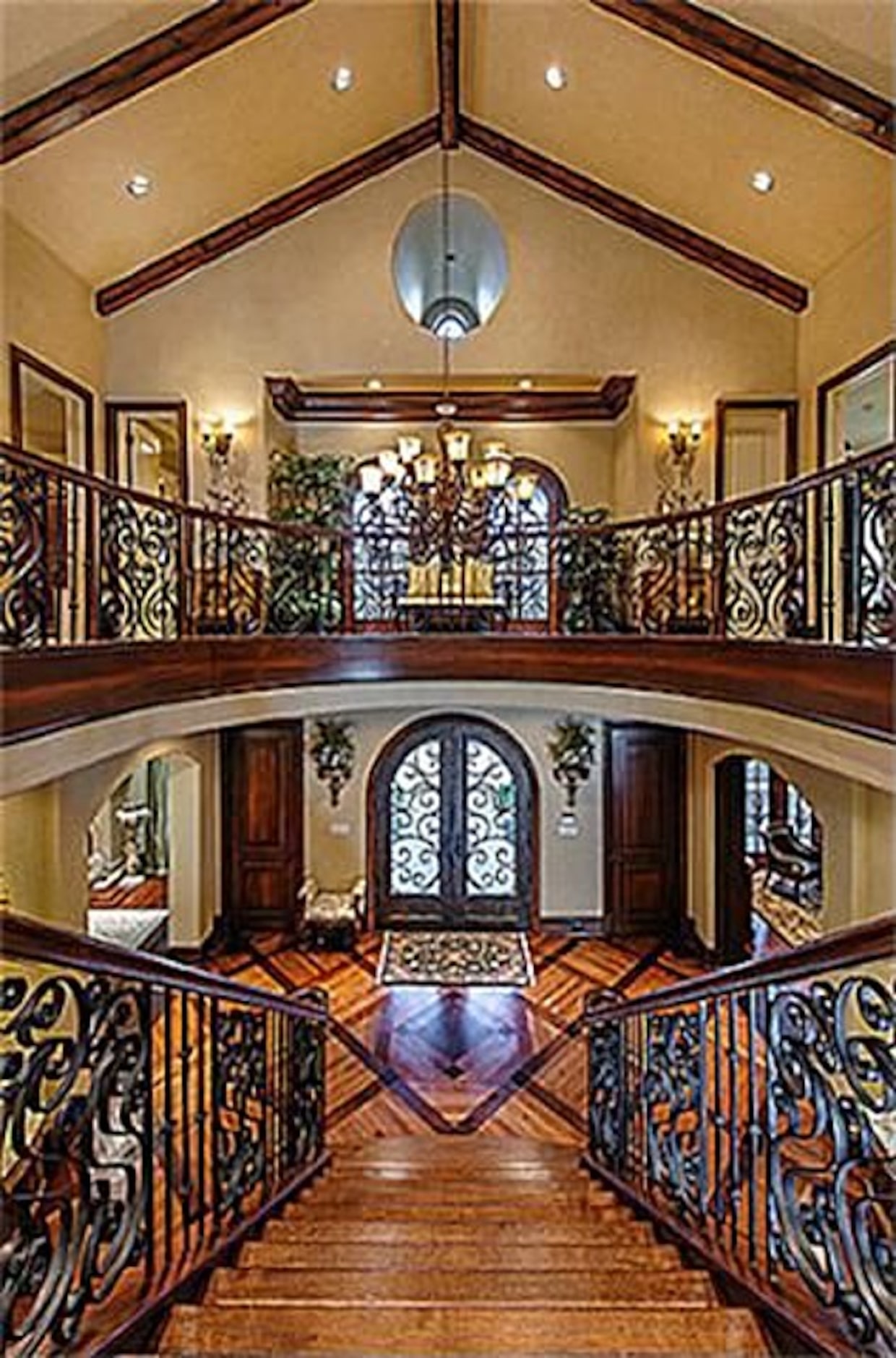 The home includes a two story formal foyer with a split staircase and an in house elevator.