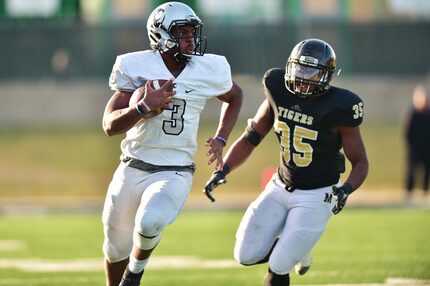 Guyer junior quarterback Shawn Robinson (3) looks for room to run on a scramble against...