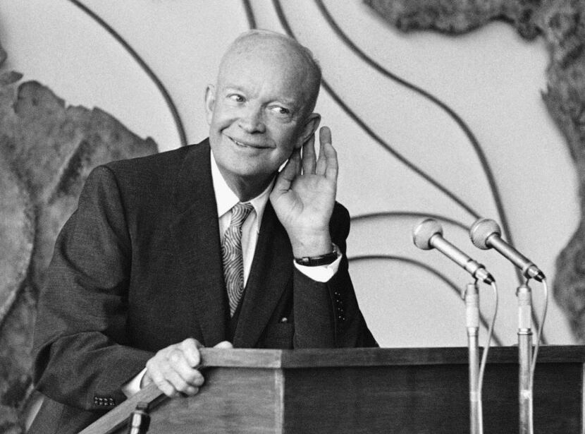 In this Aug. 27, 1959 file photo, Pres. Dwight D. Eisenhower cups his ear as he listens to a...