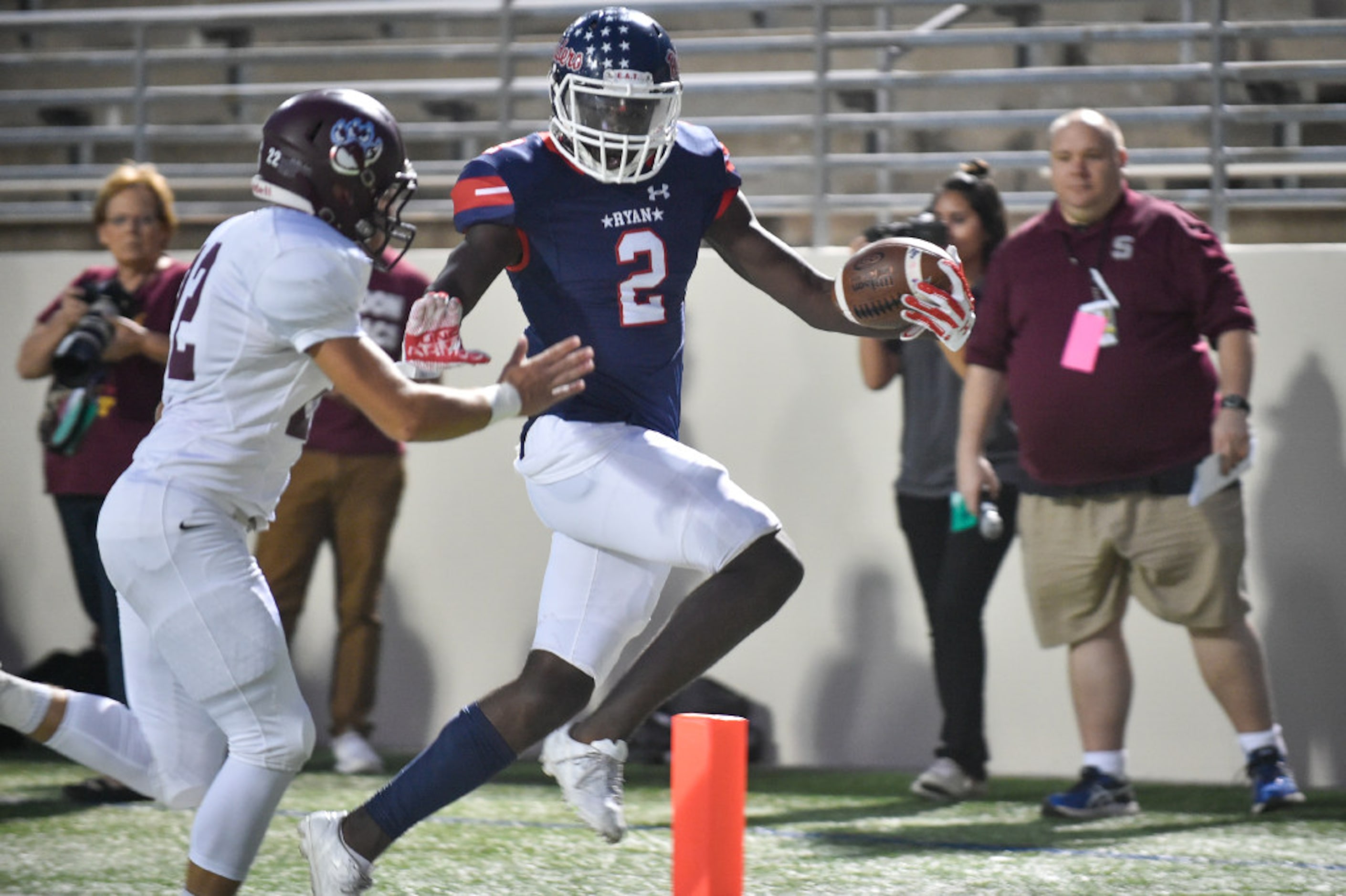 Ryan junior wide receiver Gabriel Douglas (2) makes the catch and runs for a touchdown while...