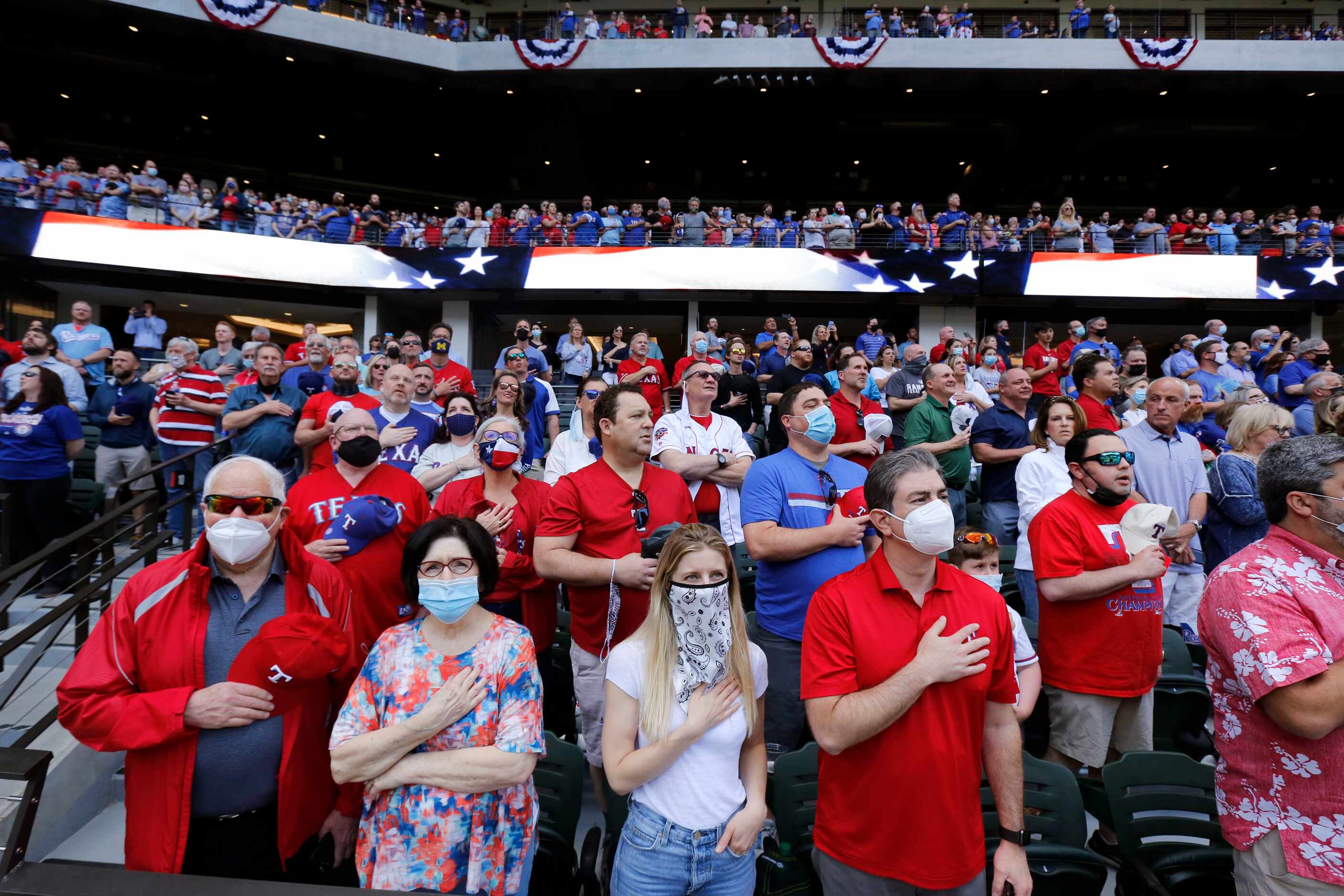 Texas Rangers fans (from left) Fred Aurbach, his girlfriend Leslie Lehman, his...