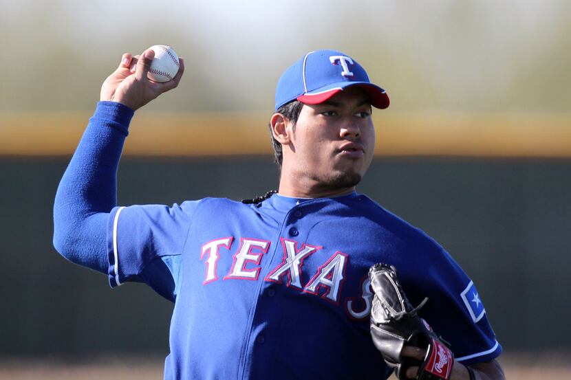 Texas Rangers starting pitcher Wilmer Font (62) pitches during Texas Rangers Spring Training...