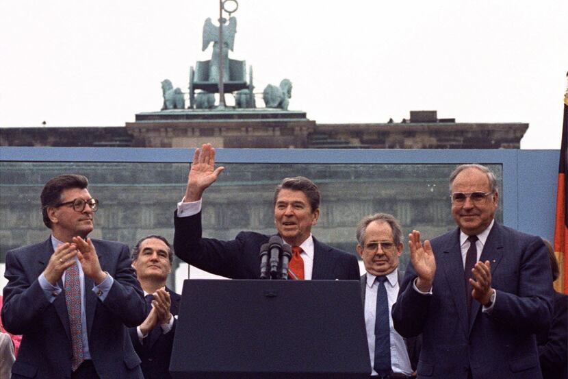 President Ronald Reagan acknowledged applause after speaking to an audience in front of the...