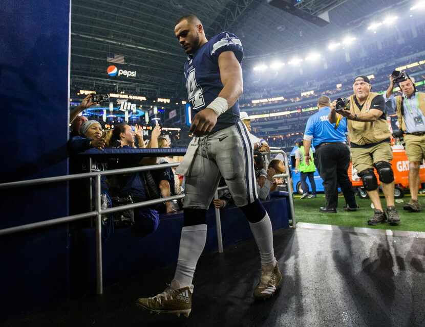 Dallas Cowboys quarterback Dak Prescott (4) walks off the field after a 28-6 loss against...