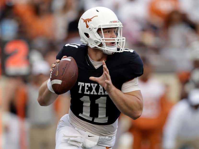 Texas quarterback Sam Ehlinger (11) looks to throw during the team's Orange-White intrasquad...