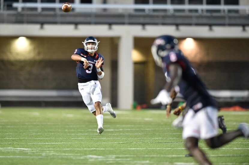 Ryan senior quarterback Spencer Sanders (3) throws a completed pass to Ryan senior wide...