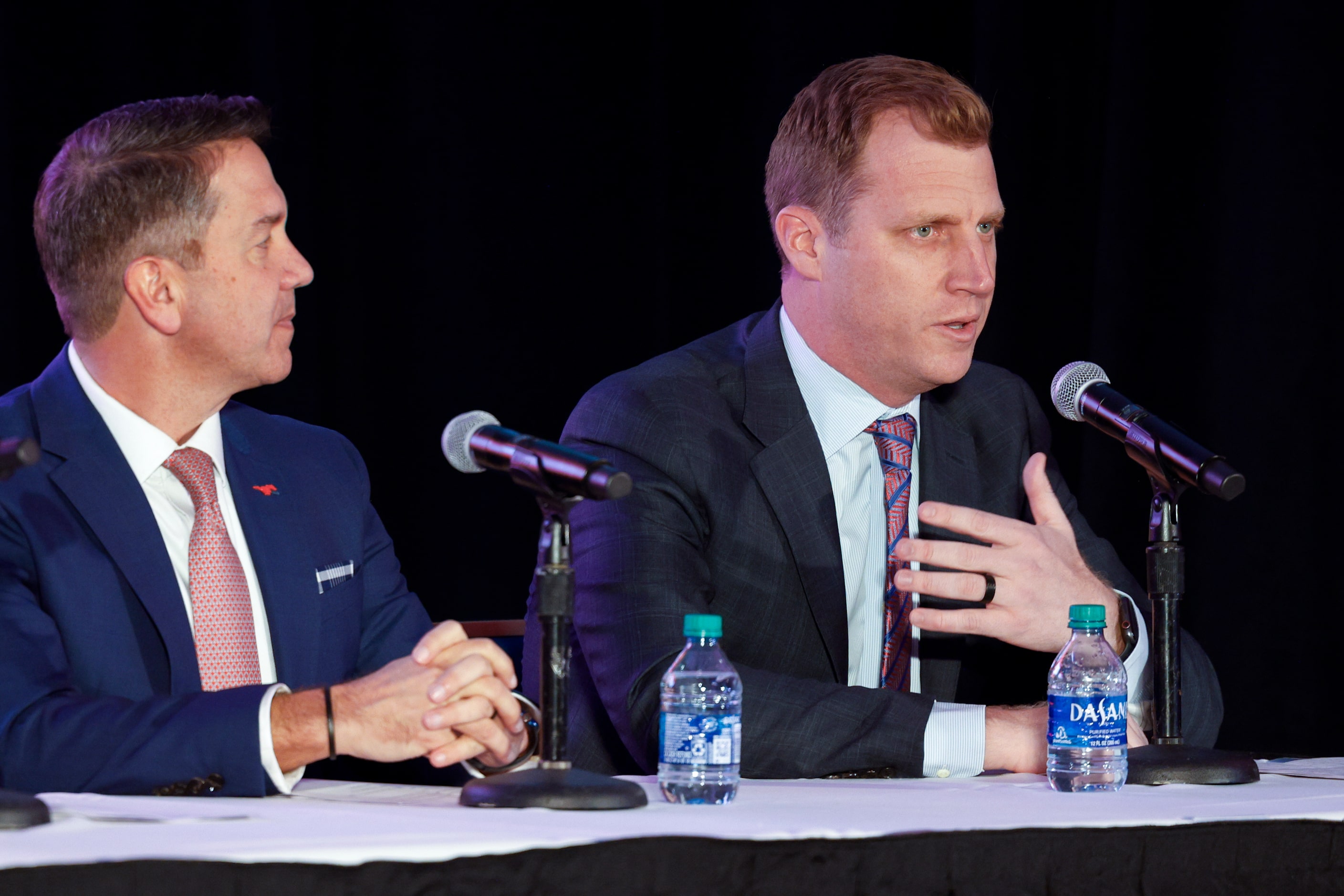 SMU athletic director Rick Hart (left) listens as SMU head football coach Rhett Lashlee...