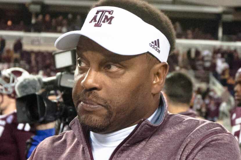 Texas A&M's head coach Kevin Sumlin talks to members of the media after an NCAA college...