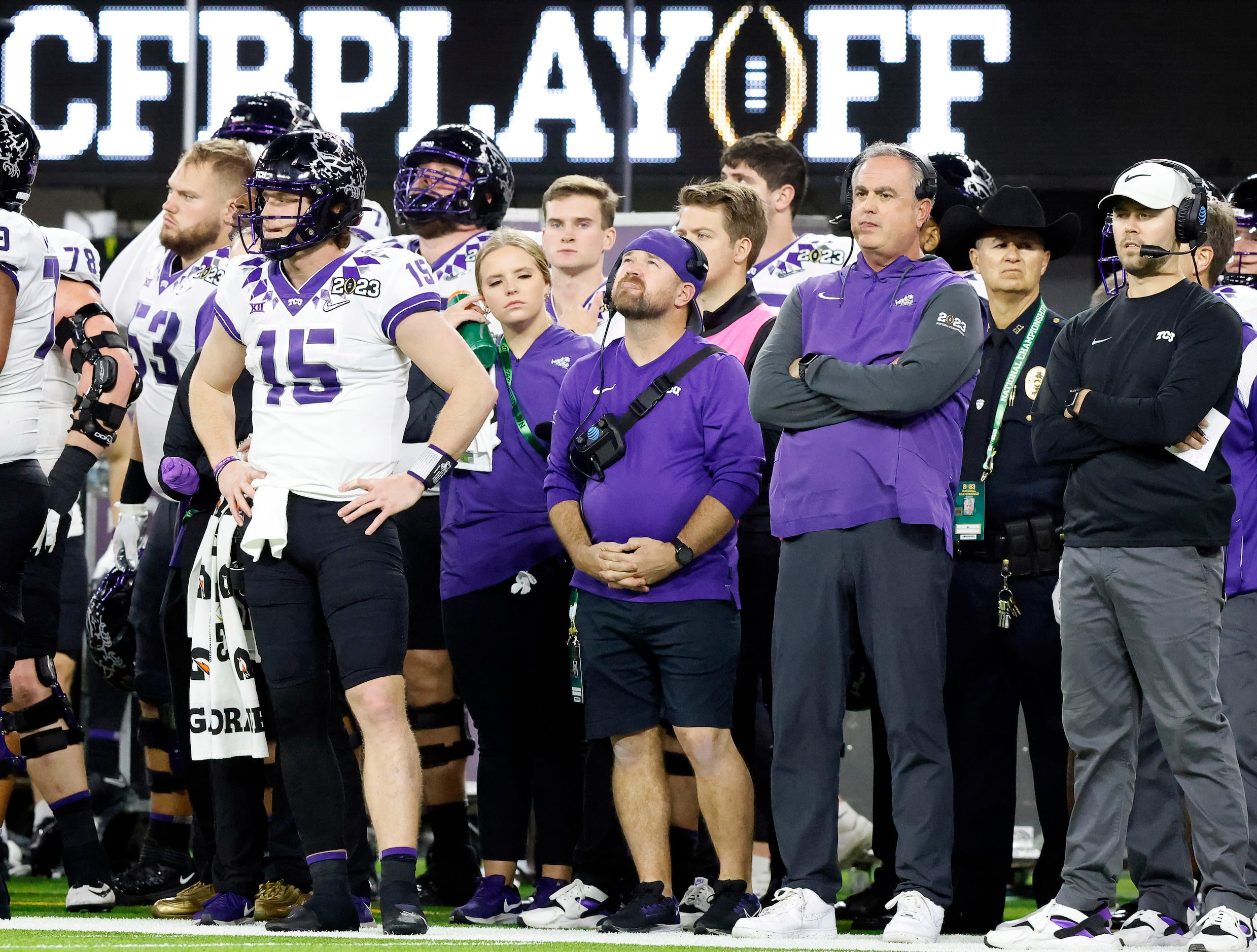 TCU Horned Frogs quarterback Max Duggan (15) and head coach Sonny Dykes can only watch from...