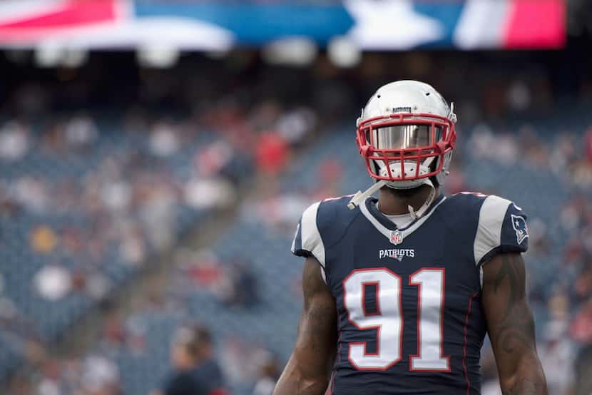 FOXBORO, MA - SEPTEMBER 18:  Jamie Collins #91 of the New England Patriots looks on before...