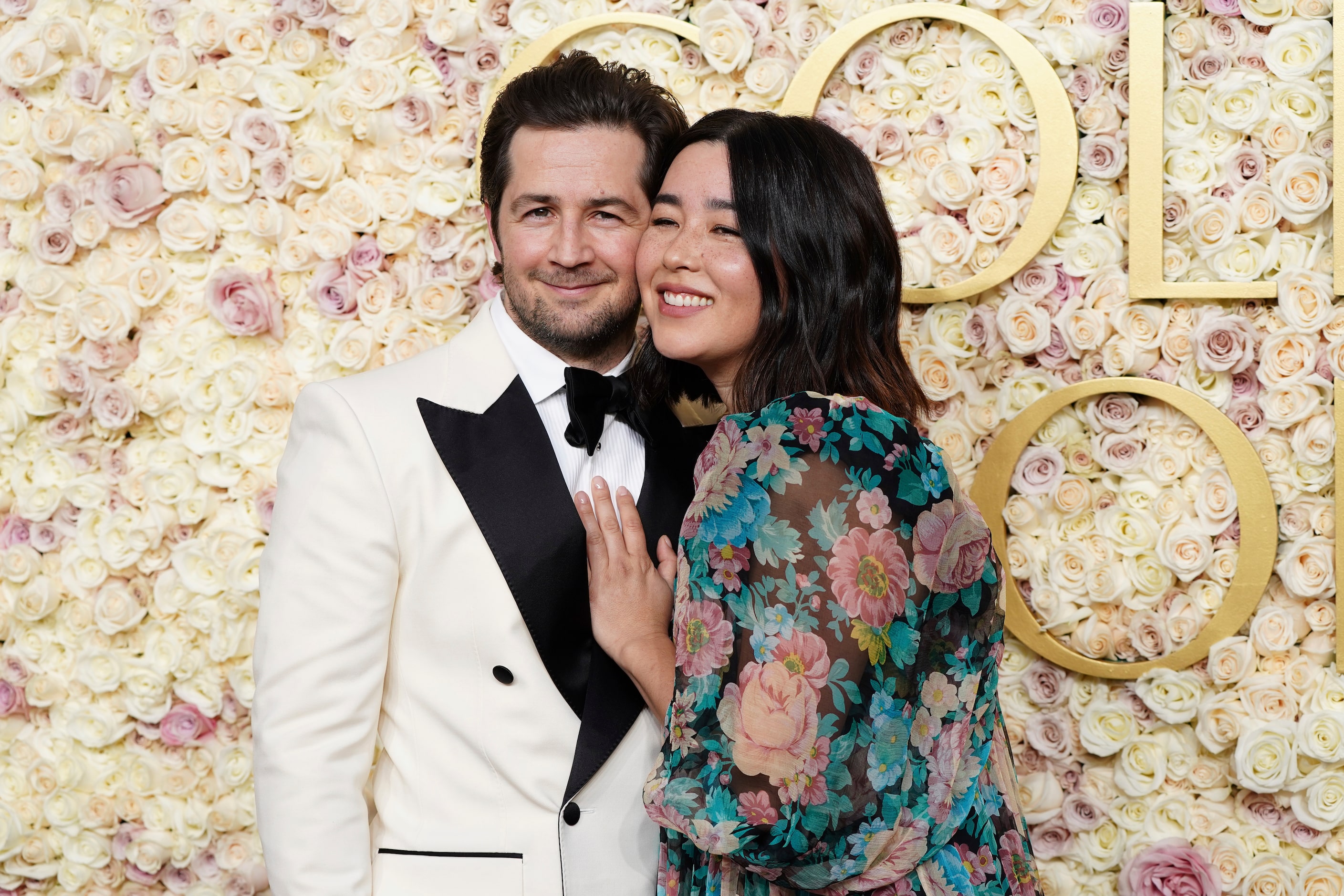 Michael Angarano, left, and Maya Erskine arrive at the 82nd Golden Globes on Sunday, Jan. 5,...