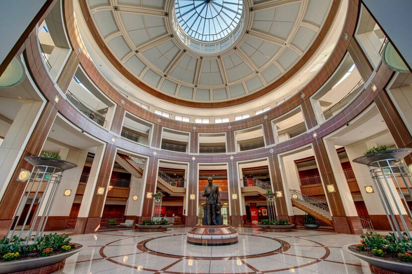 Penney founder James Cash Penney's statue sits in the atrium in the retailer's Plano...