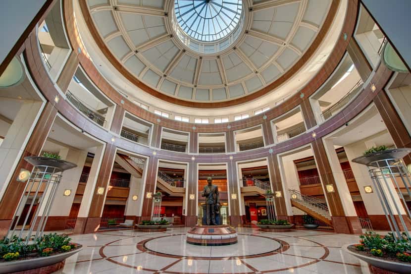 Penney founder James Cash Penney's statue sits in the atrium in the retailer's Plano...