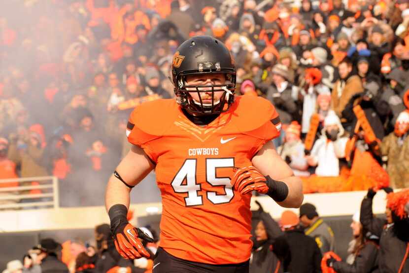 Oklahoma State linebacker Caleb Lavey prepares for an NCAA football game in Stillwater,...