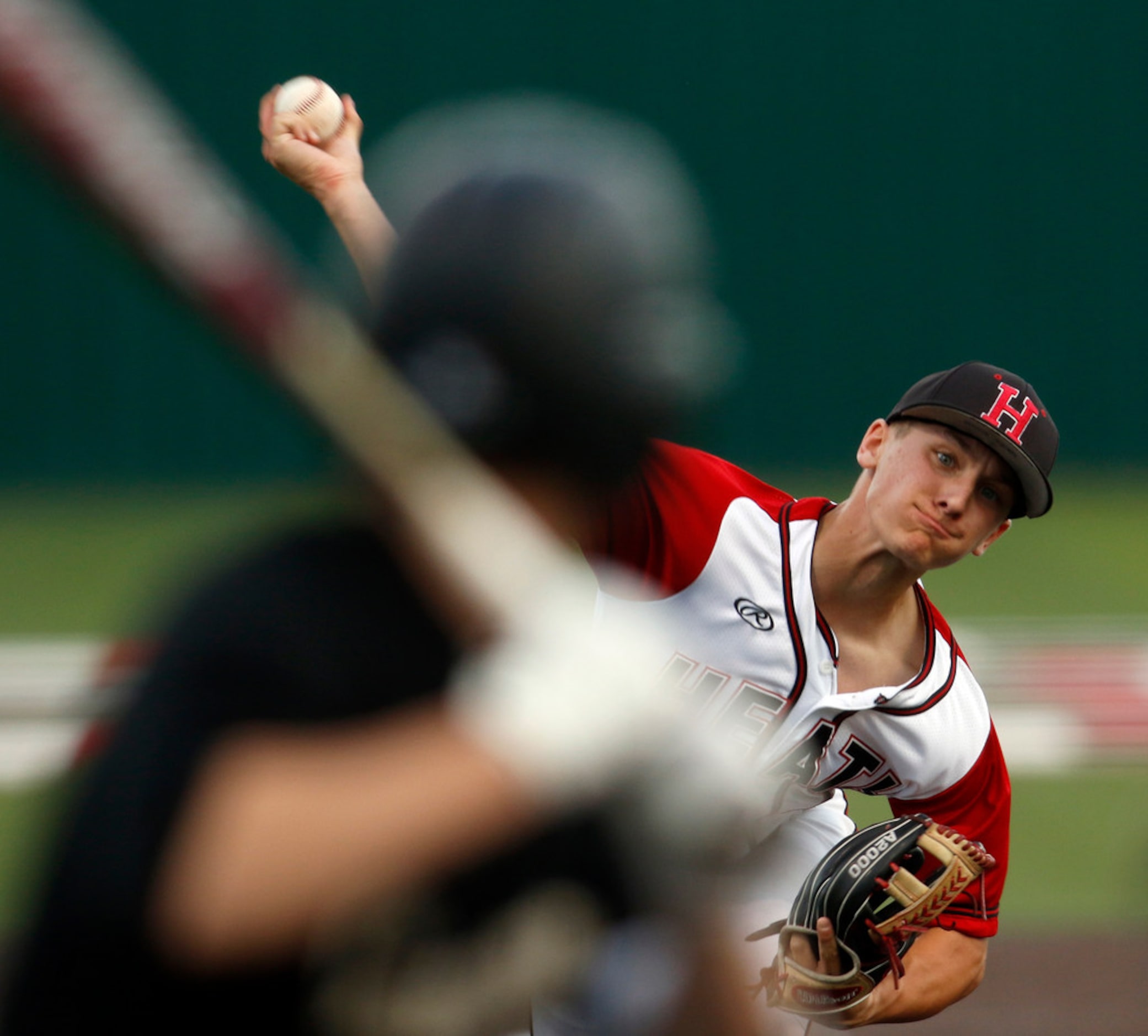 Rockwall Heath pitcher Jett Williams (4) delivers a pitch during second inning play against...