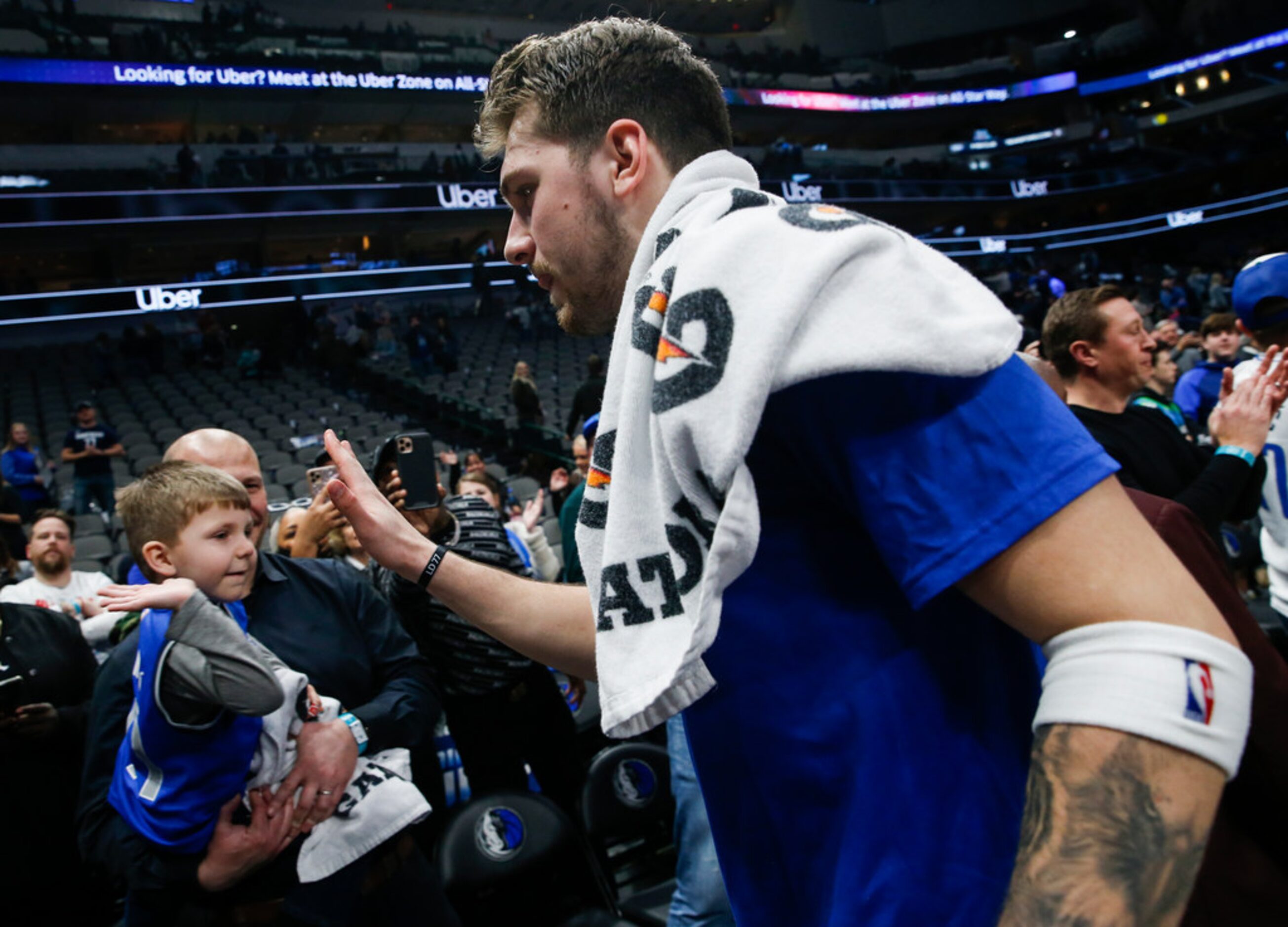 Dallas Mavericks guard Luka Doncic (77) exits the court following a win over the Sacramento...