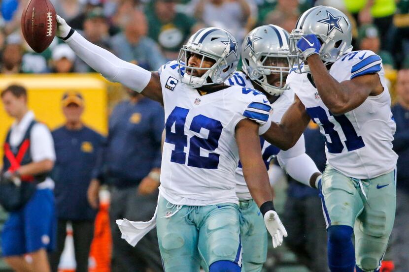 Dallas Cowboys strong safety Barry Church (42) celebrates his interception in the third...