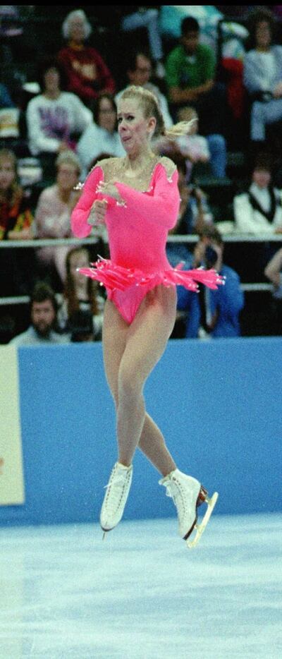 Tonya Harding of Portland, Ore., twists above the ice as  she completes her routine on her...