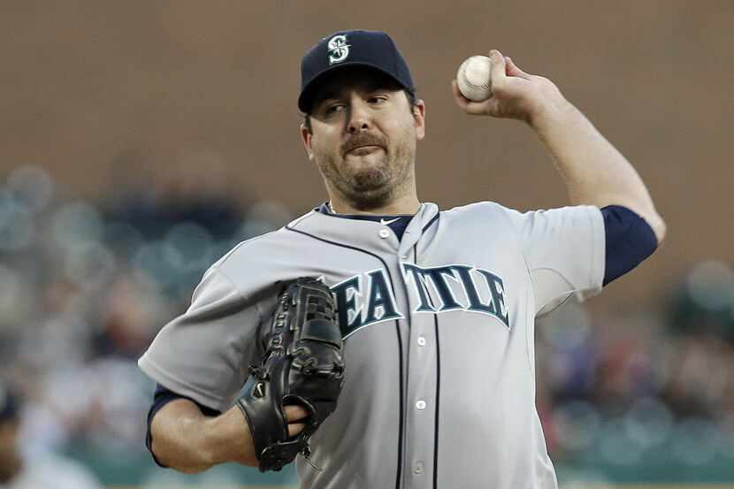 FILE - In this Sept. 16, 2013, file photo, Seattle Mariners pitcher Joe Saunders throws...