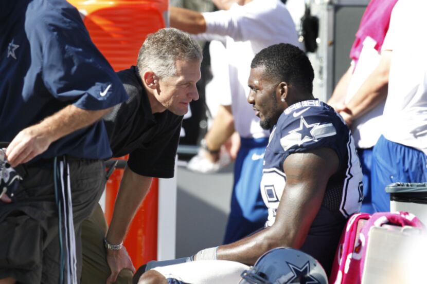 Dallas Cowboys wide receiver Dez Bryant (88) is checked out on bench after he was injured on...