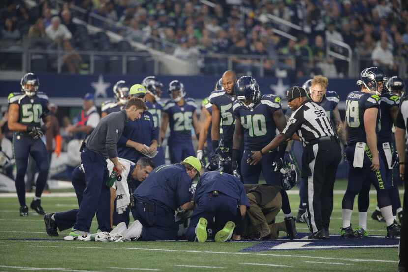 Ricardo Lockette is tended to after a neck injury during a Seahawks-Cowboys game on November...