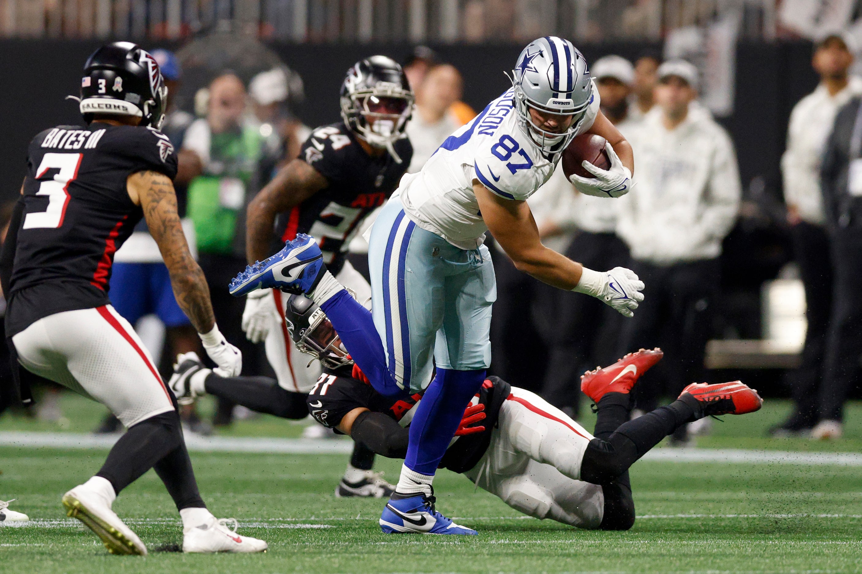 Atlanta Falcons safety Justin Simmons (31) tackles Dallas Cowboys tight end Jake Ferguson...