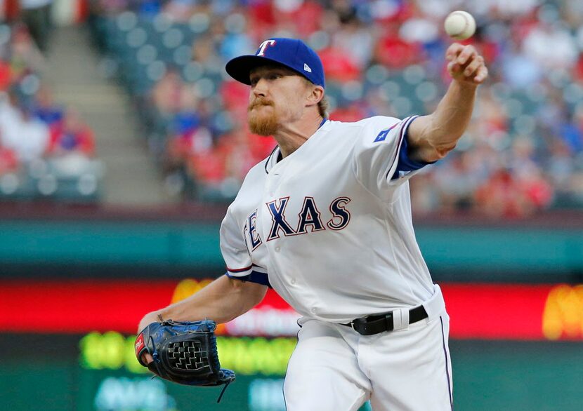 Texas Rangers relief pitcher Jake Diekman (41) throws a ninth-inning pitch during the...