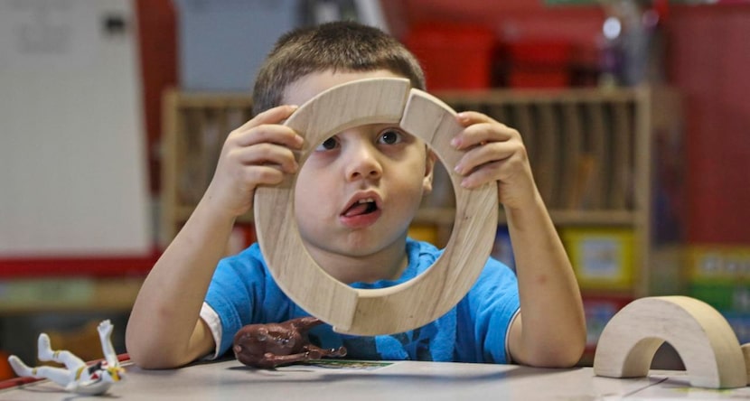 
Adam Delrio, 3, plays with building blocks at Destiny Learning Center in Dallas. The day...