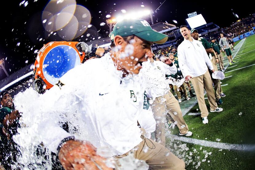 ORLANDO, FL - DECEMBER 29:  Head coach Art Briles of the Baylor Bears has water dumped on...