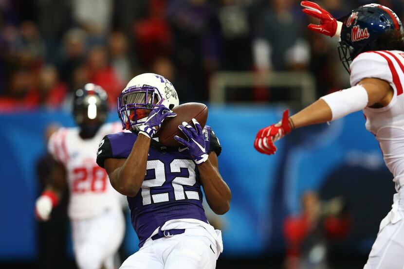 ATLANTA, GA - DECEMBER 31: Aaron Green #22 of the TCU Horned Frogs scores a touchdown in the...