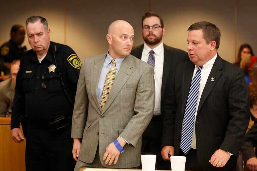 A sheriff's deputy escorted Roy Oliver from the courtroom after he was convicted of murder...